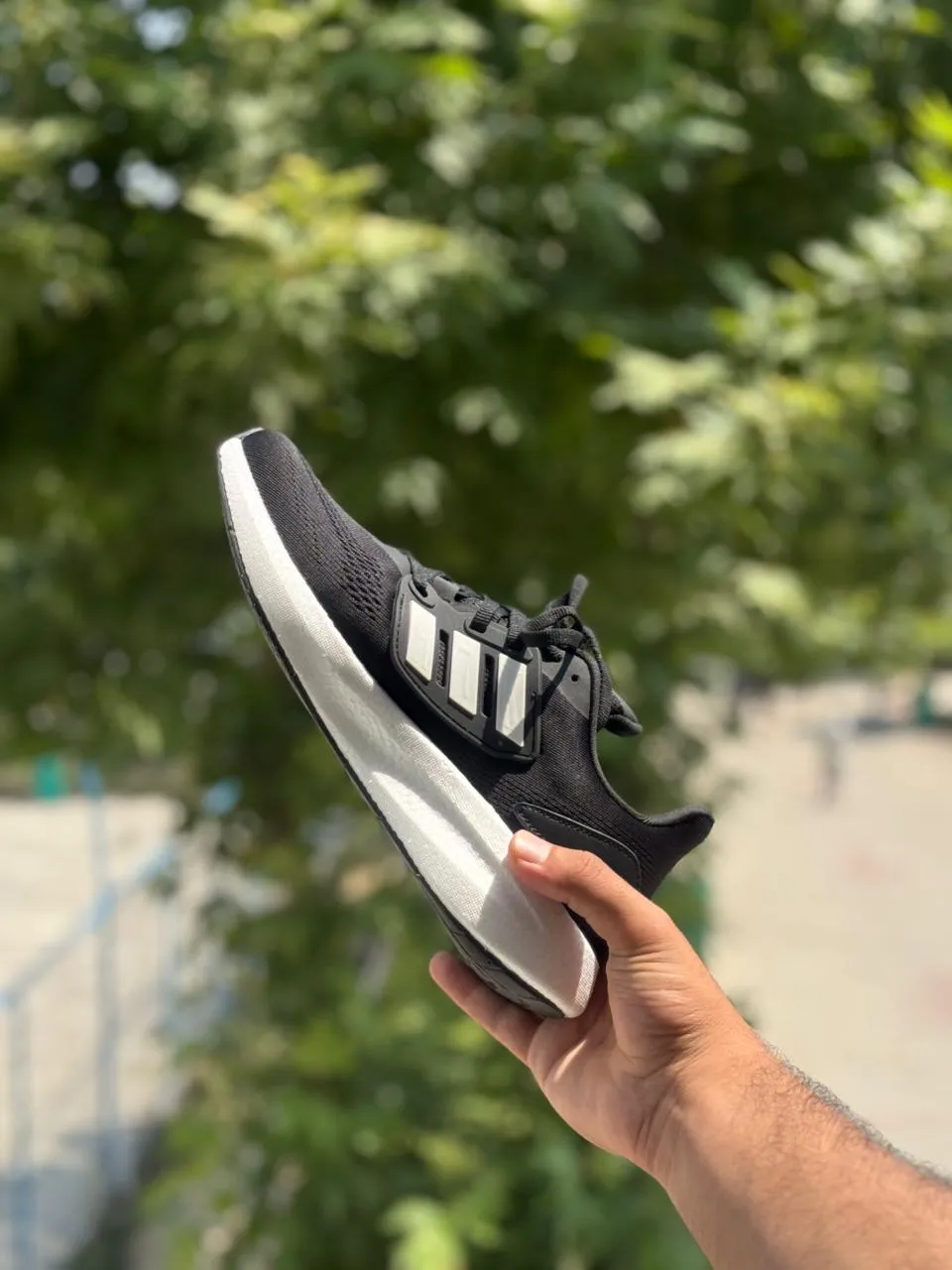 Front view of Adidas pureboost 22 Black & White