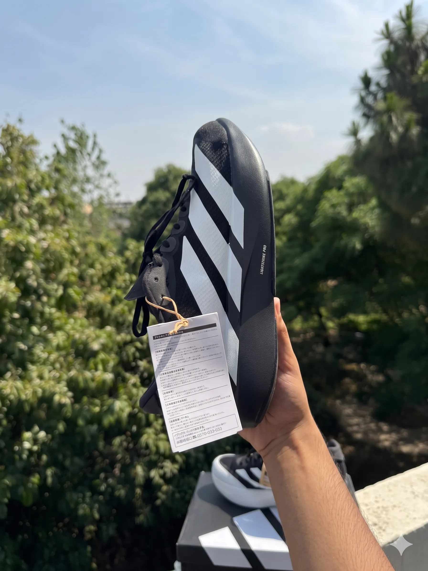 Side view of Adidas Adizero EVO SL - Black