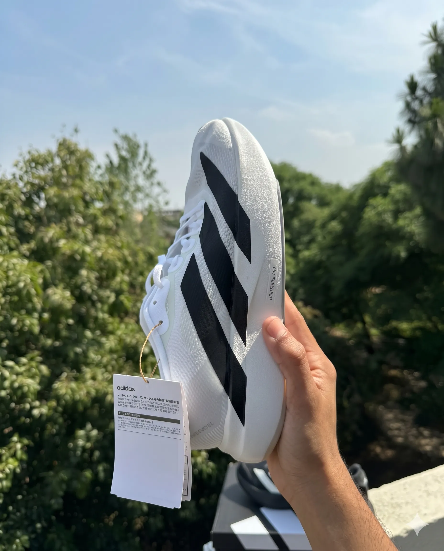 Side view of Adidas Adizero EVO SL - White