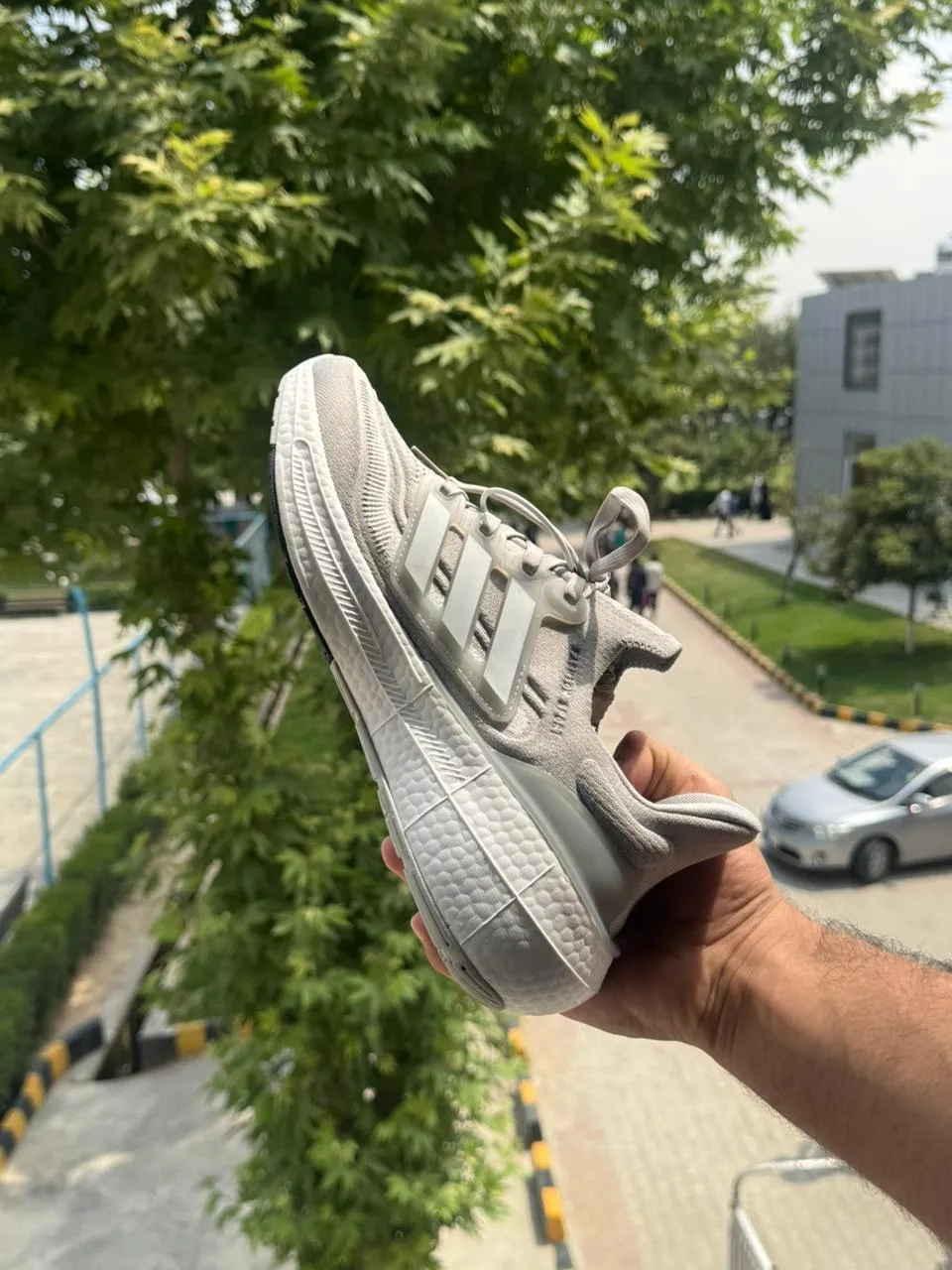 Front view of Adidas Ultraboost Light - Halo Silver / Cloud White